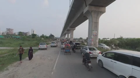 Metro Rail Track View from Diyabari to Mirpur with Lake and Traffic Stock Footage 335367690