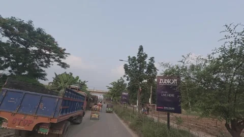 Metro Rail Track View from Diyabari to Mirpur with Lake and Traffic Stock Footage 335373932