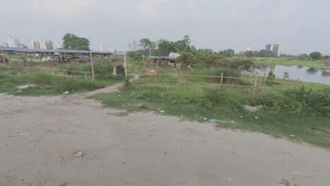 Metro Rail Track View from Diyabari to Mirpur with Lake and Traffic Stock Footage 335374431