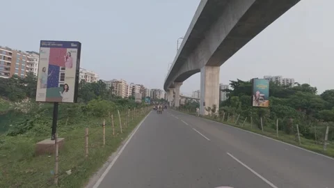 Metro Rail Track View from Diyabari to Mirpur with Lake and Traffic Stock Footage 335375430