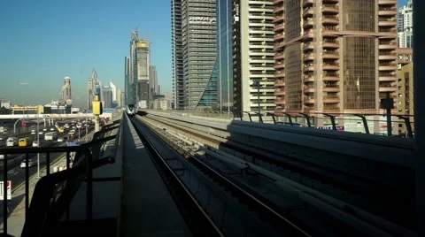 A metro returns to the station in Dubai, UAE 스톡 동영상 64223013