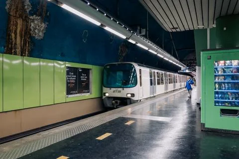 Metro station in Marseille. Empty platform with approaching train. Undergro.. Stock Photos
