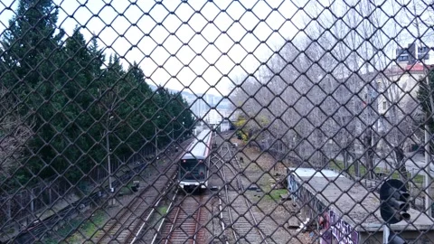 Metro train approaches from an open station Stock Footage 260527260