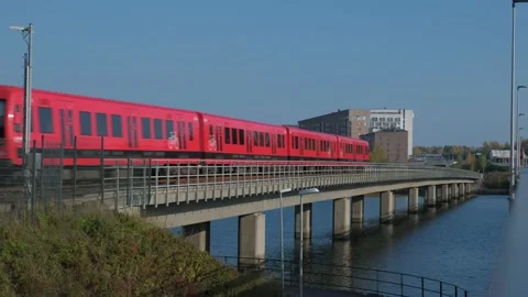 Metro train are moving on the bridge over the water Stock Footage 163091033
