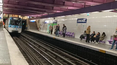 A metro train arrives at the Concorde Station in Paris, France Stock-Footage 342112088