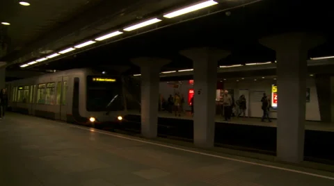 Metro train arriving at platform in Rotterdam subway station. Pan shot Stock Footage 42490902