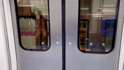 Metro train arriving at station with automatic gate opening to deboarding Stock Footage 219442119