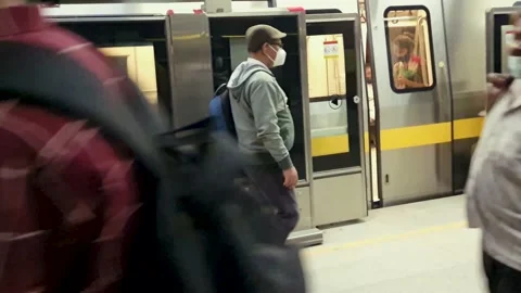 Metro train automatic entrance gate leaving station at morning Stock Footage 219442140