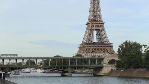 Metro train on the bridge over the river close to the Eiffel tower in Paris 動画素材 73077269