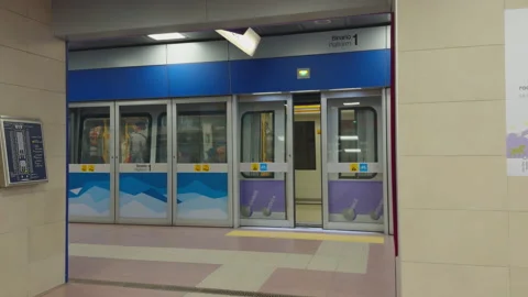 Metro train doors closing before departure at Tre Torri station on Milan M5 line Stock Footage 336909799
