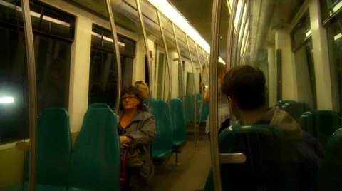 Metro train interior, arriving at station. People commuting. Light flashes Stock Footage 42492026