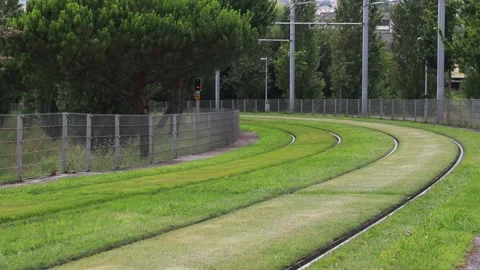 The metro train leaves due to a bend and heads forwards through open terrain. Stock Footage 134123918