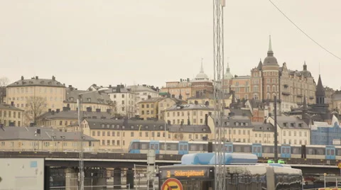 Metro train moving on bridge in cityscape Video stock 65875070