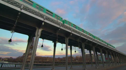 Metro train over Bir-Hakeim bridge. Famous landmark in Paris Stock Footage 234751633
