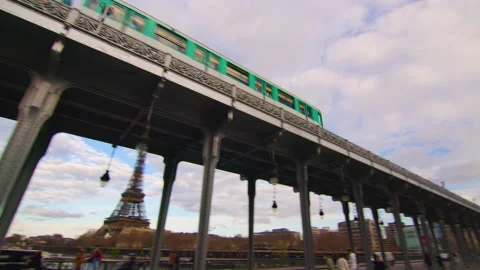Metro train over Bir-Hakeim bridge and the Eiffel Tower, Paris, France Stock Footage 236904490