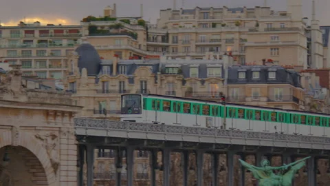 Metro train over Bir-Hakeim bridge and the Eiffel Tower, Paris, France Stock Footage 236904598
