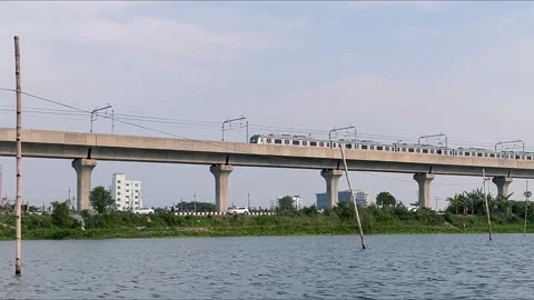 A Metro Train Passes by a lake  . Stock Footage 274249831