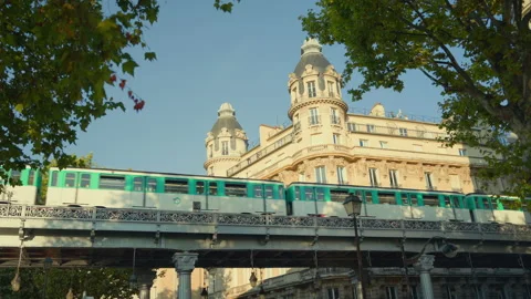 Metro train passing along the Parisian street in summer Stock Footage 233269284