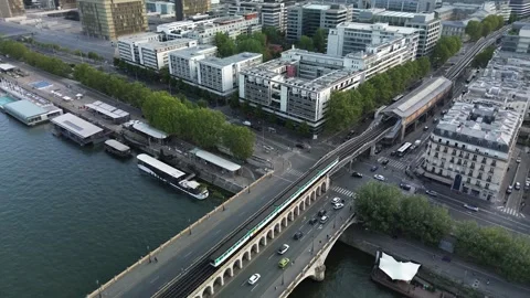 Metro train passing on Bercy bridge towards Quai de La Gare station, Paris Stock Footage 265418676