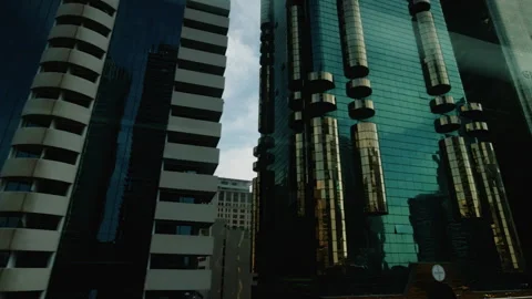 Metro Train Passing Modern Glass Towers in Dubai Business District Afternoon Stock Footage 342060764