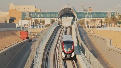 A metro train rides to a modern station in the city of Riyadh Stock Footage 305357488