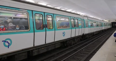 Metro Train At Underground Subway Station In Paris, France. pan tracking Stock Footage 255923974