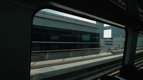 Metro Train Window View Passing Modern City Buildings in Dubai Daylight Stock Footage 342060900
