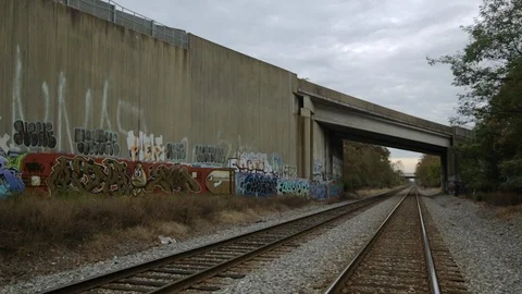 Metro training crossing over train tracks 스톡 동영상 120037049