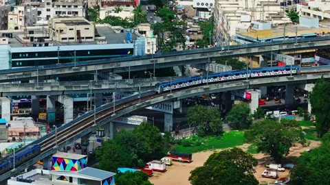 Metro trains with elevated tracks, Maitrivanam building, residential buildings Stock Footage 346505938