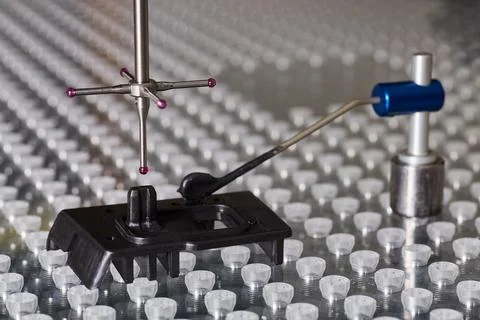 Metrology CMM programming machine probe abstract background wall of parts to Stock Photos