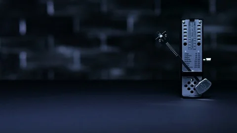 Metronome in action, on a plain background. Stock Footage 99102077