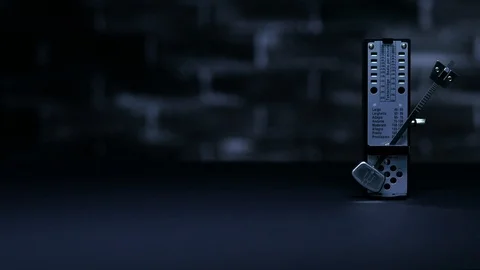 Metronome in action, on a plain background. Stock Footage 99102078
