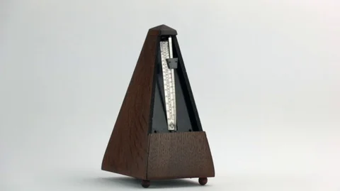 Metronome in action on a white background Stock Footage 107051767