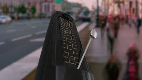 Metronome on the background of people walking down the street Stock-Footage 133635903