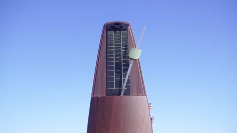 Metronome Pendulum Movement on Blue Background. 動画素材 347656870