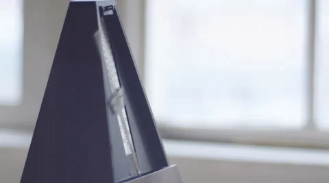 Metronome in window Stock Footage 34533783