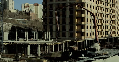 Metropolis .Built high building. Builders are building homes Stock Footage 63344024