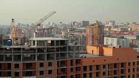 Metropolis .Built high building. Builders are building homes Stock Footage 76458716