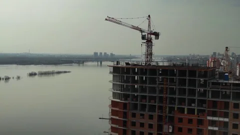 Metropolis .Built high building. Builders are building homes Stock Footage 76458764