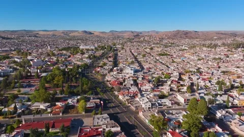 Metropolitan Horizon: Mid-Afternoon Aerial Sweep of Durango Cityscape Stock Footage 340265731