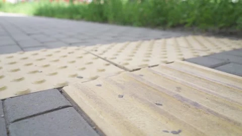 Metropolitan navigation: Elevated view of tactile pavement with braille markings Stock Footage 278590225
