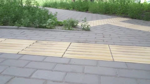 Metropolitan navigation: Elevated view of tactile pavement with braille markings Stock Footage 278590265