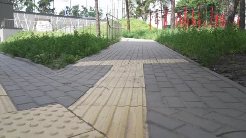 Metropolitan navigation: Elevated view of tactile pavement with braille markings Video stock 278590294