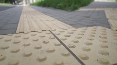 Metropolitan navigation: Elevated view of tactile pavement with braille markings Stock Footage 278590362