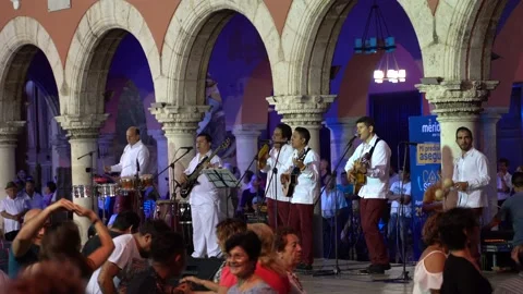 Mexican band performs outside at night in Merida, Mexico. Video stock 159079598