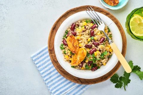 Mexican black bean corn quinoa salad with caramelized lemon in old vintage cl Stock Photos