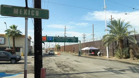 Mexican Border Streets by US Border Wall Boundary Barrier Mexico California Line Stock Footage 101073133