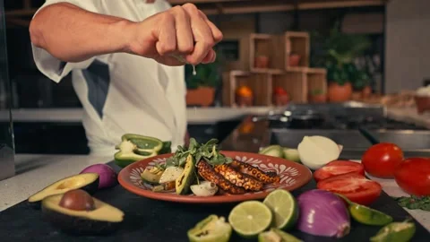 Mexican Chef is Preparing Mexican dishes for dinner at a resort hotel Stock Footage 280704137