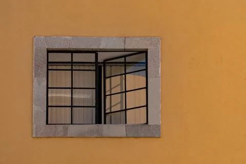 Mexican classic colonial style window with yellow wall in Guanajato Mexico Stock Photos