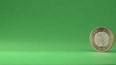 A Mexican coin spinning from right to left on a chroma background. Stock Footage 141638257